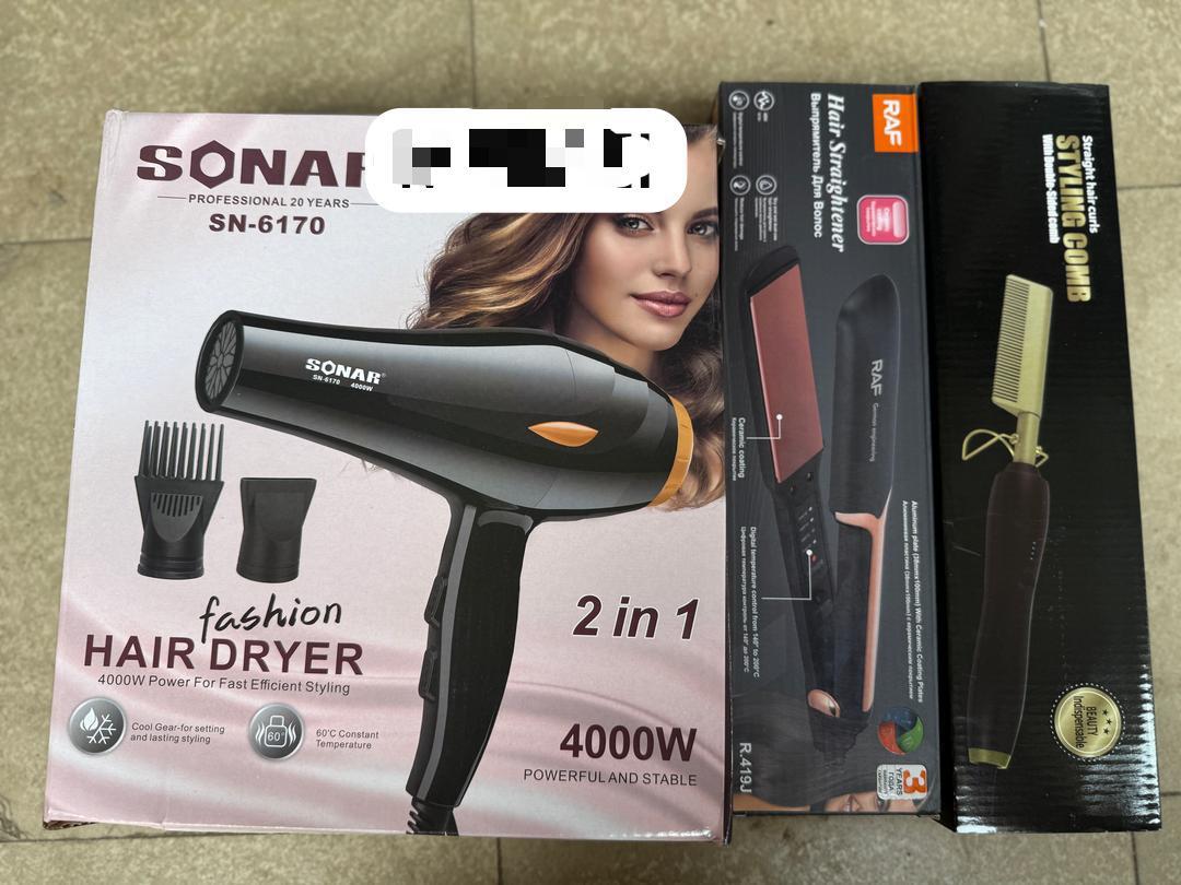 Pack complet Gril Hair Dryer avec séchoir, diffuseur et embouts posé sur une table