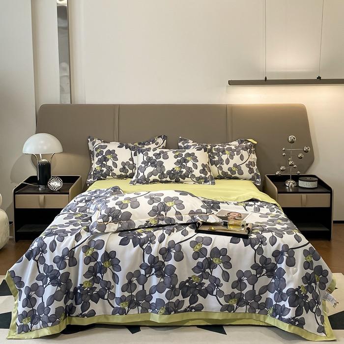 Détail d'une taie d'oreiller et du drap, montrant la finesse du tissu